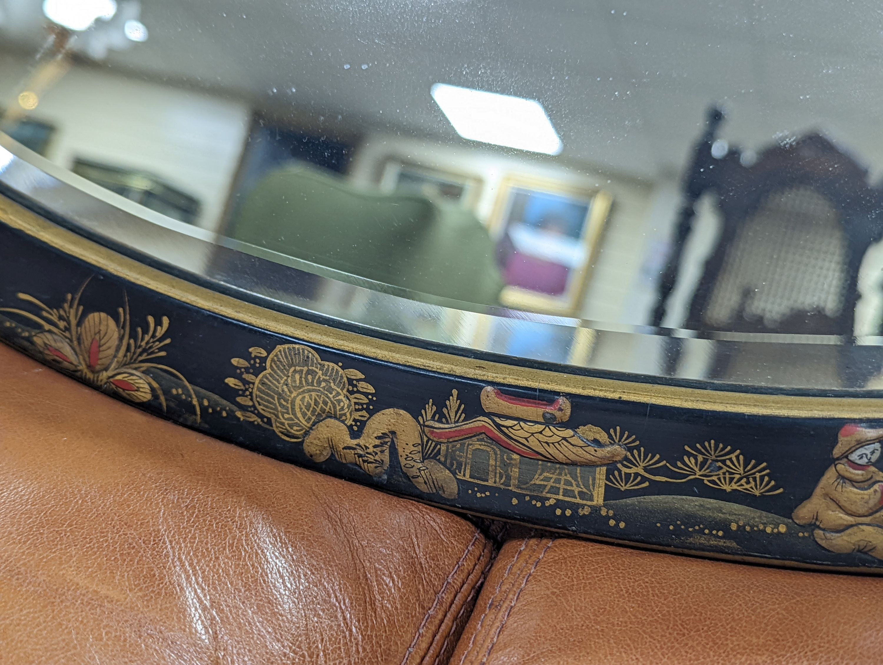 A 1920's oval chinoiserie lacquer wall mirror, width 67cm, height 46cm - To be sold on behalf of The Ukraine Appeal